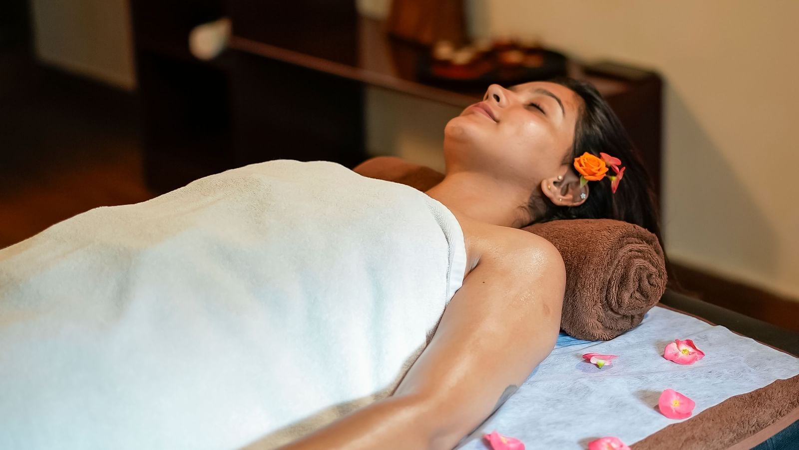 Lady lying on a massage table at WOW Bungalow, Yercaud.