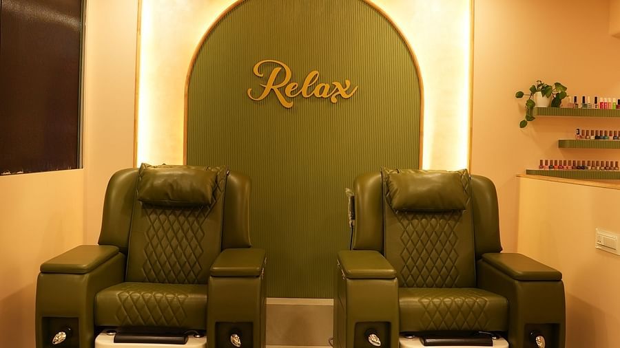 pedicure area with two sofas in view and led lights shining from above - IOSIS Spa & Wellness