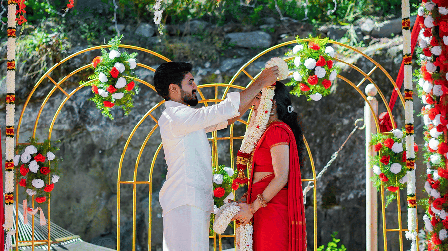  Outdoor wedding mandap at Grand Palace, Yercaud, floral hanging décor, couple holding hands, stages, floral mats, backdrop and soft lighting for ceremony