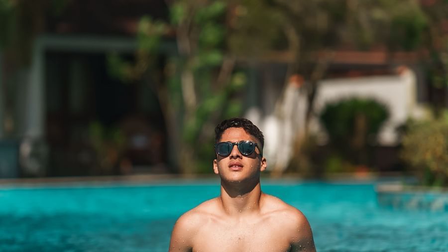 an image of a person in the pool posing for a picture - Rhythm Kumarakom