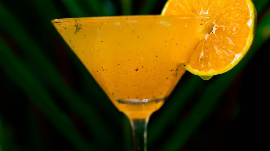 Rhythm Kumarakom - a closeup shot of a mocktail with an orange peel