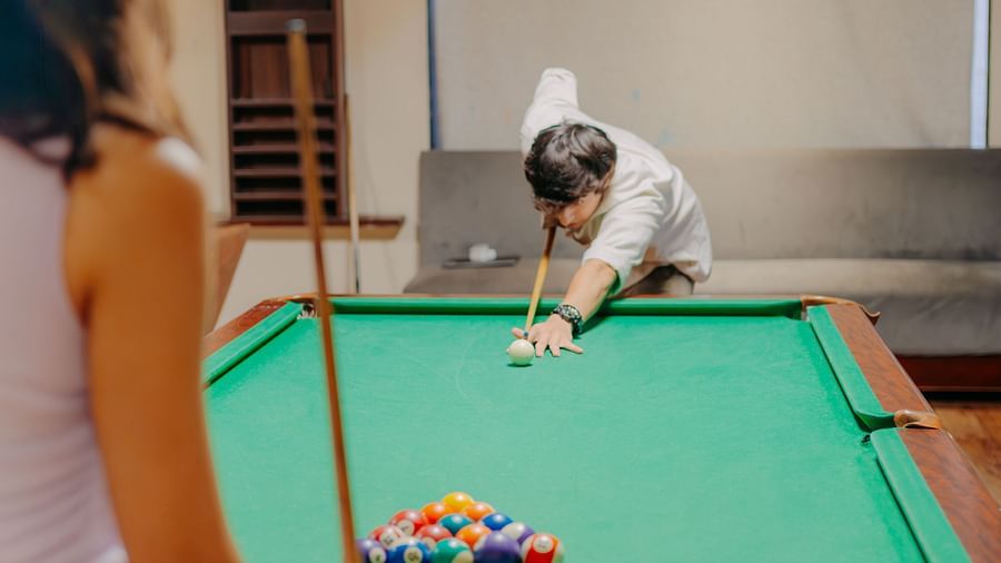 A man concentrating on his next shot in a game of snooker at Crescent Spa & Resort, Indore