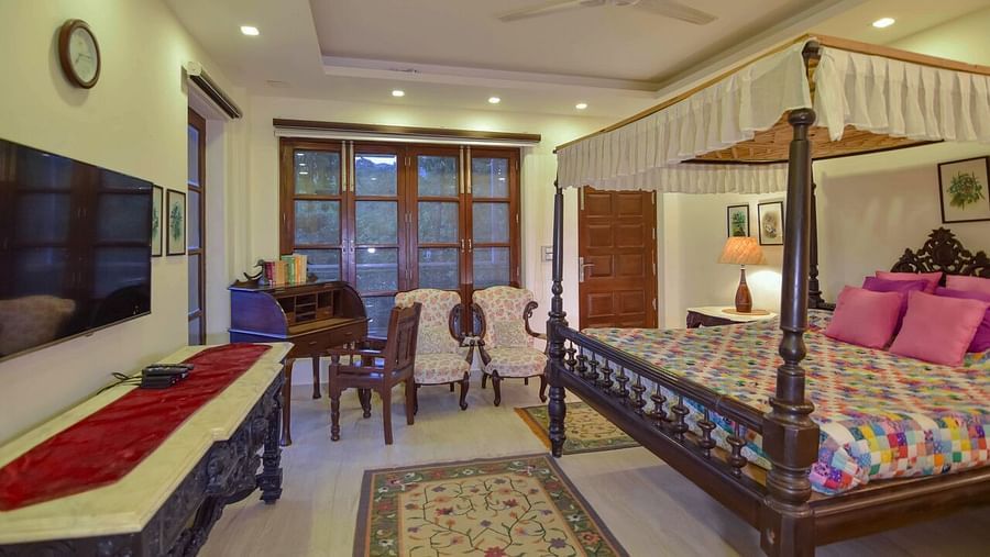 Image of interior of a Hotel Room with bed at Shaheen Bagh Resort Dehradun