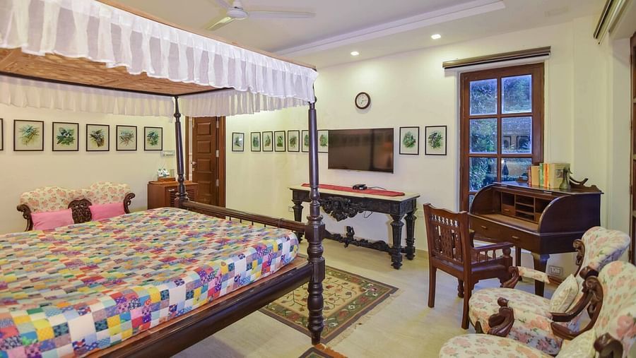 Image of interior of a Hotel Room with bed at Shaheen Bagh Resort Dehradun