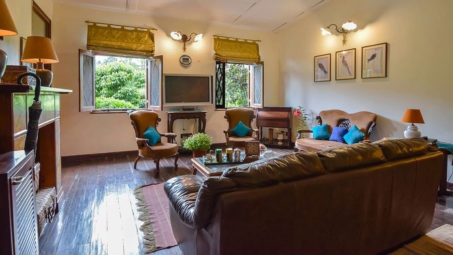 Image of interior of living area of a Hotel Room at Shaheen Bagh Resort Dehradun