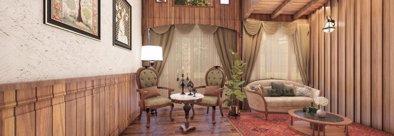 Traditional sitting room with a vaulted wooden ceiling, panelled walls, and ornate furniture set on a red rug at BluSalzz Terrah Hills Resort, Dalhousie.
