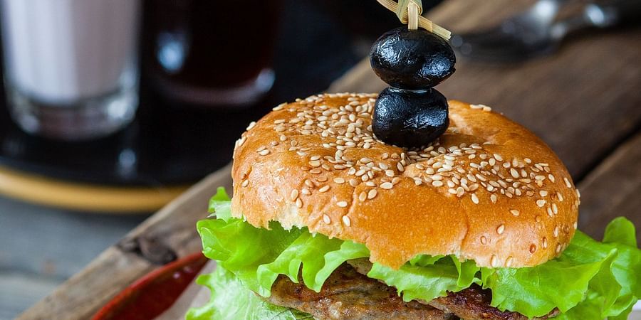 alt-text a burger at our restaurant in Agartala