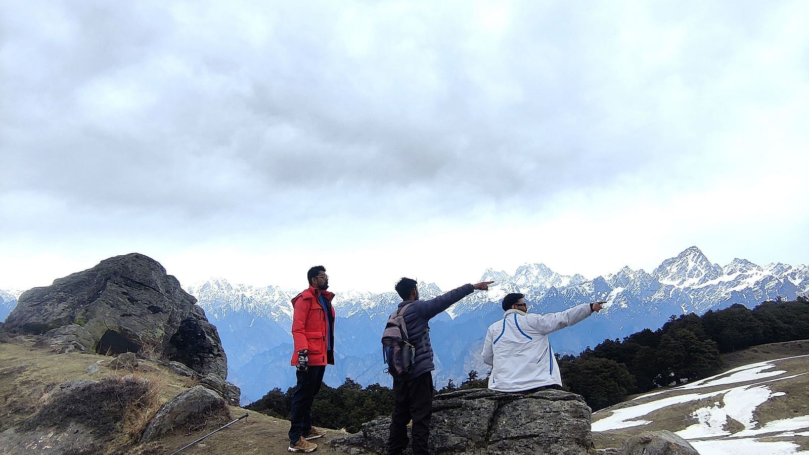 Image of three individuals looking at the view in front of them at Garson Valley | Faraway Cottages, Auli