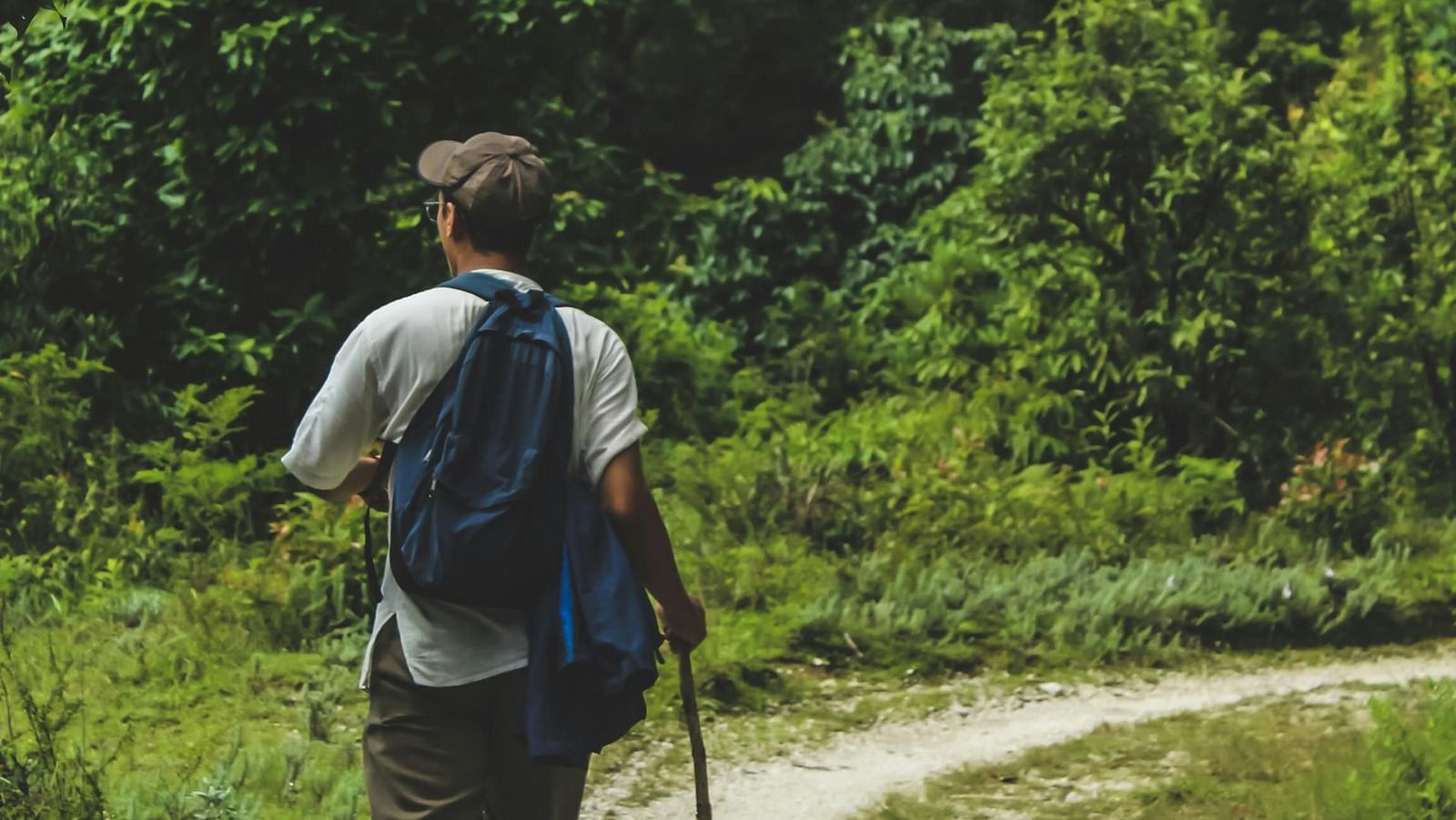 Man walking on trail.