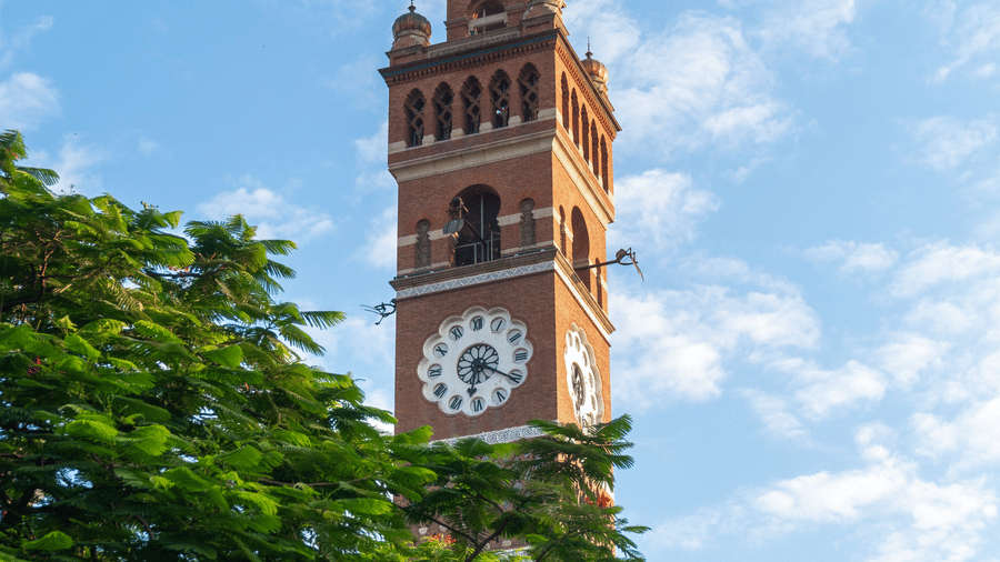 Scenic view of the iconic Hussainabad Clock Tower against a clear blue sky in Lucknow.