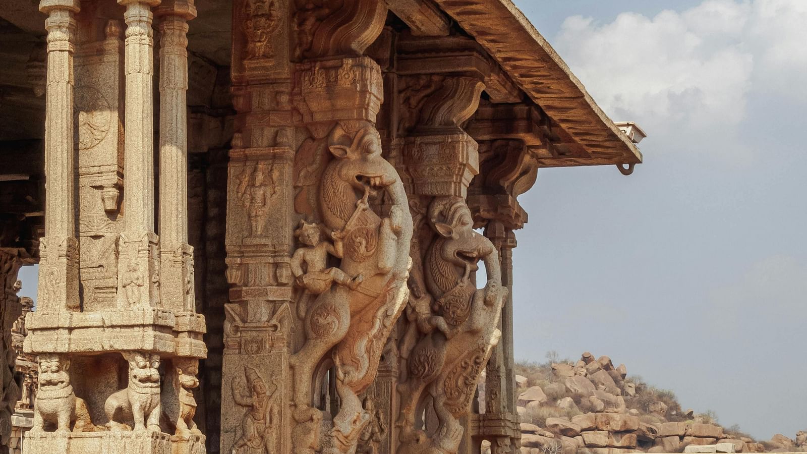 Ancient stone temple with intricate carvings and weathered architecture.