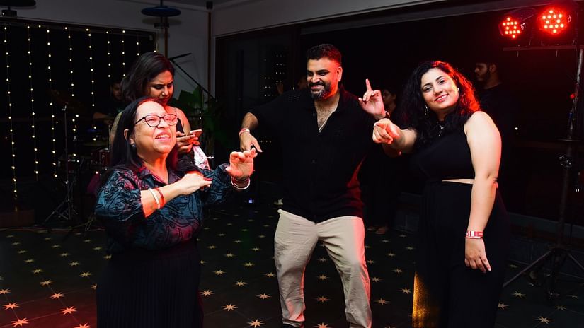 A group of people dancing and enjoying the music at Cloud9 Sarovar Premiere, Palolem Goa.