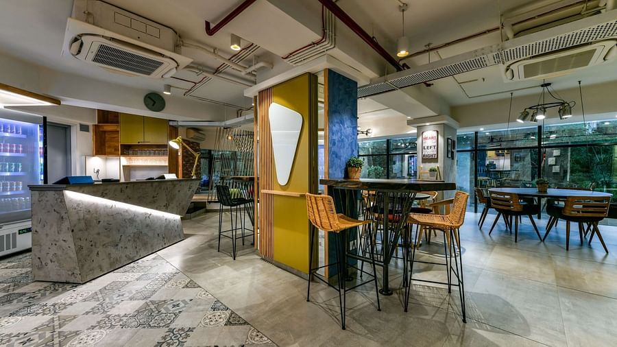 A lobby area with a seating arrangement featuring high chairs at Indie Stays, BKC Kalina.