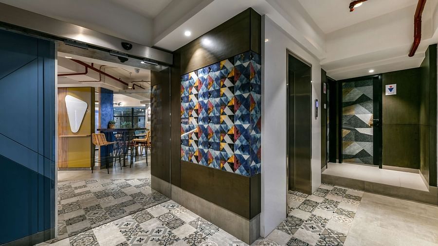 A corridor with diverging paths leading to two sides at Indie Stays, BKC Kalina.