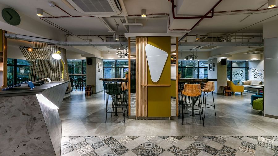 A lobby area with a seating arrangement featuring high chairs at Indie Stays, BKC Kalina.