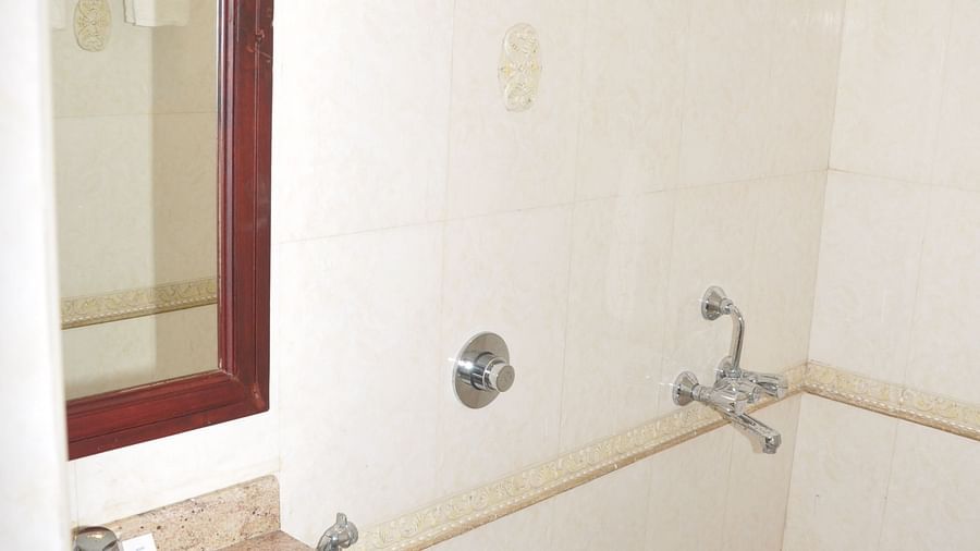 vanity area of a washroom at Hotel Alps Residency, Krishnagiri