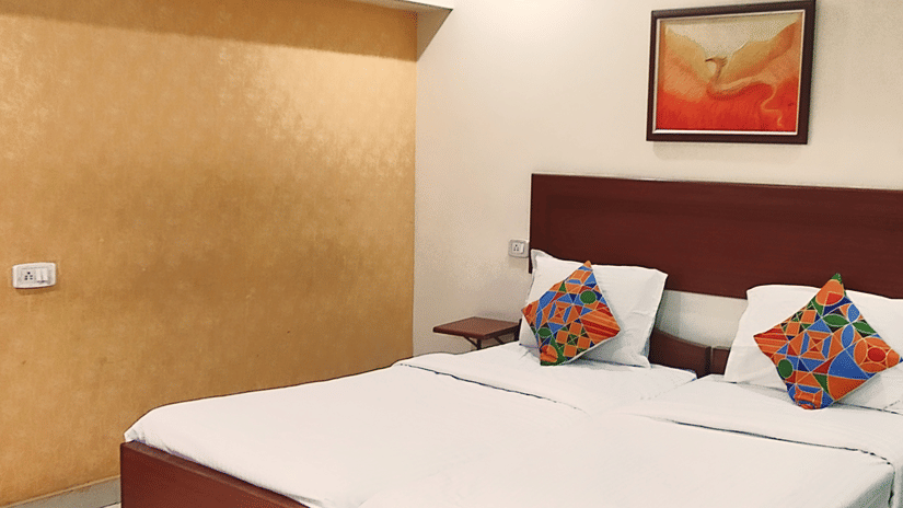 Spacious Executive Room at Udipi Home with double bed and modern decor