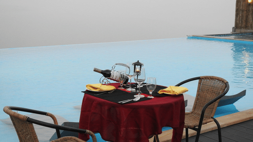 a table for two beside the pool