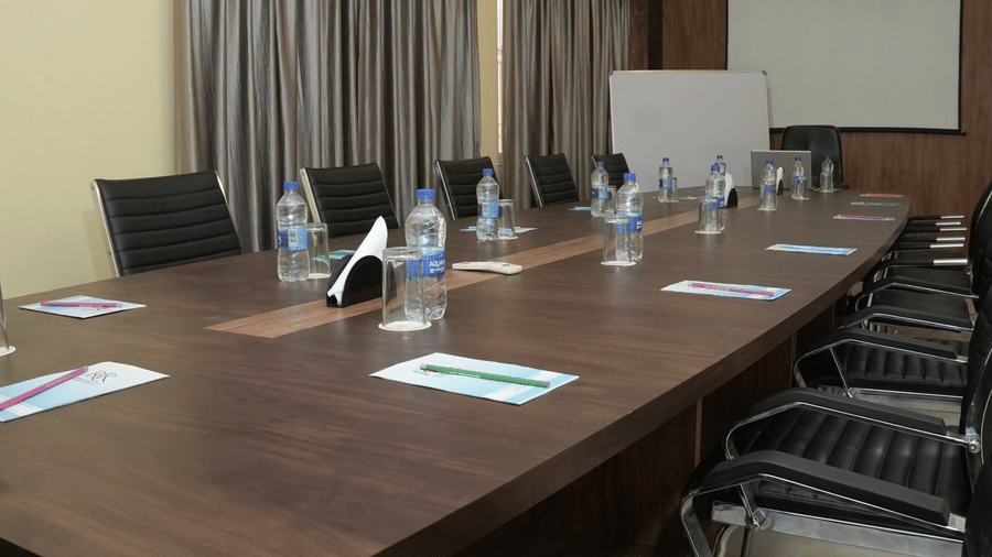 A clean and modern conference room ready for a private executive session at the Ram Bhawan Ram Yamuna Prasad Hotel and Resort.