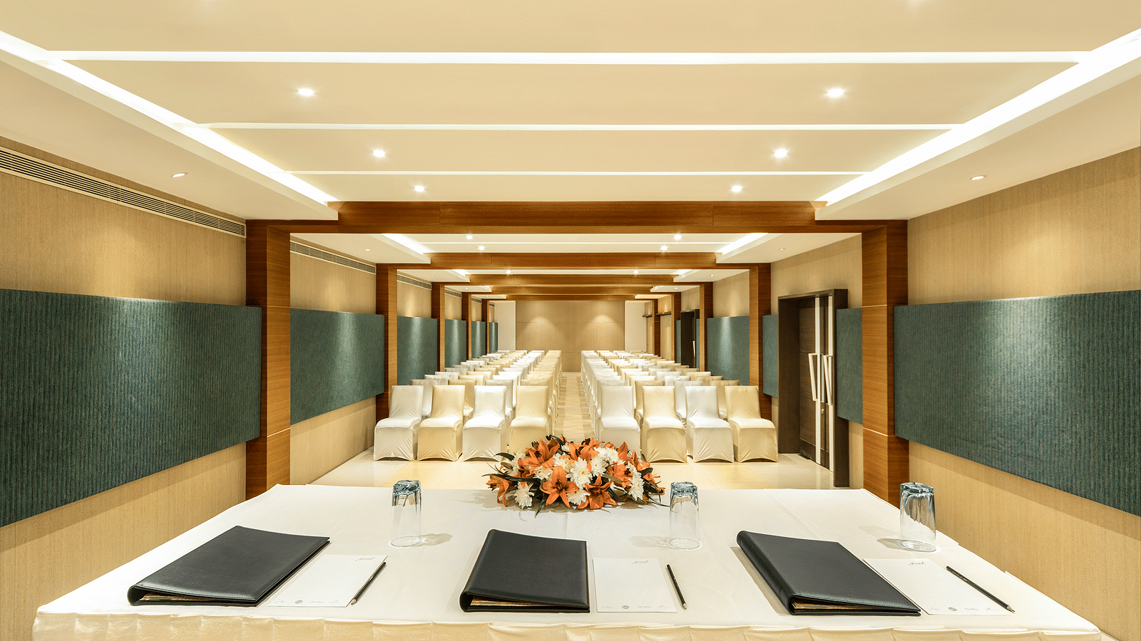image of an event hall with seating arrangement at  Grand Kakinada by GRT Hotels