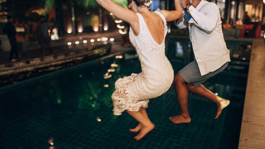 people jumping into pool
