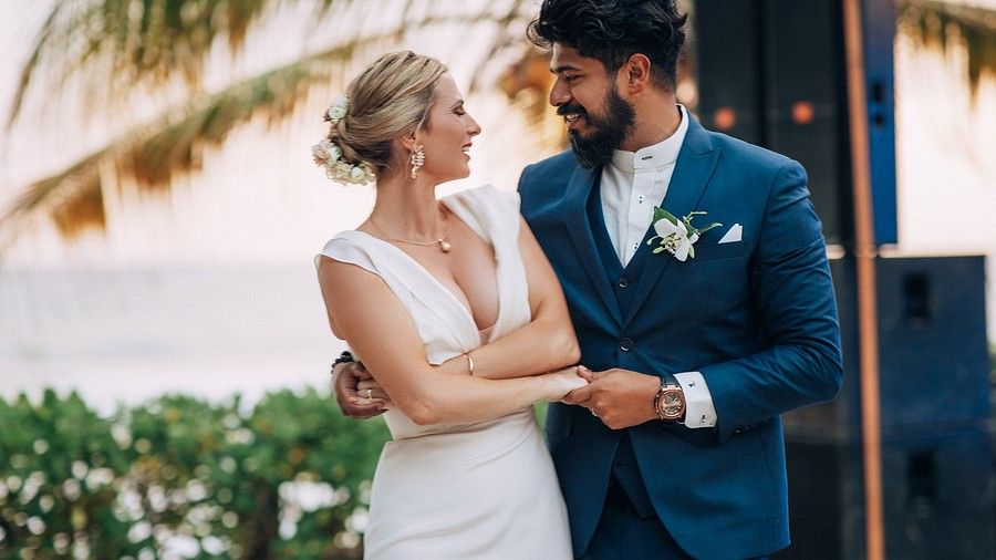 couple holding hands and smiling at each other