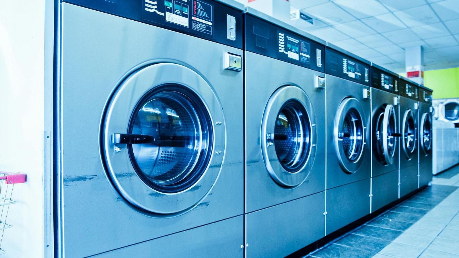 A series of washing machines arranged one after the other.