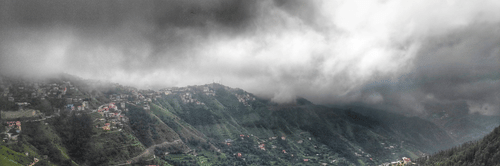 The image showcases a breathtaking mountain view, with towering peaks, lush greenery, and a serene landscape, offering a peaceful and majestic atmosphere.