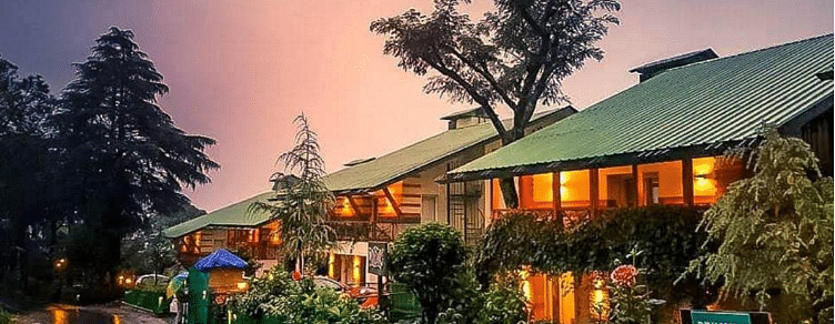 An enchanting exterior of our hotel decorated with aesthetic yellow lights and captured during sunset - Lamrin Norwood Green, Palampur2