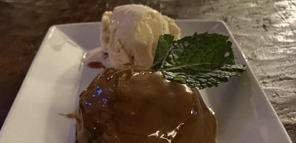 A dessert with icecream served on a plate