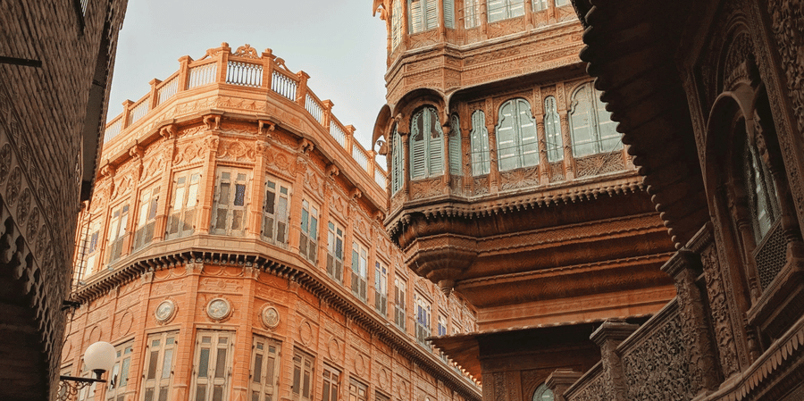 Rampuria Haveli in Bikaner, Rajasthan featuring symmetrical buildings standing next to each other which has ancient architectural designs.