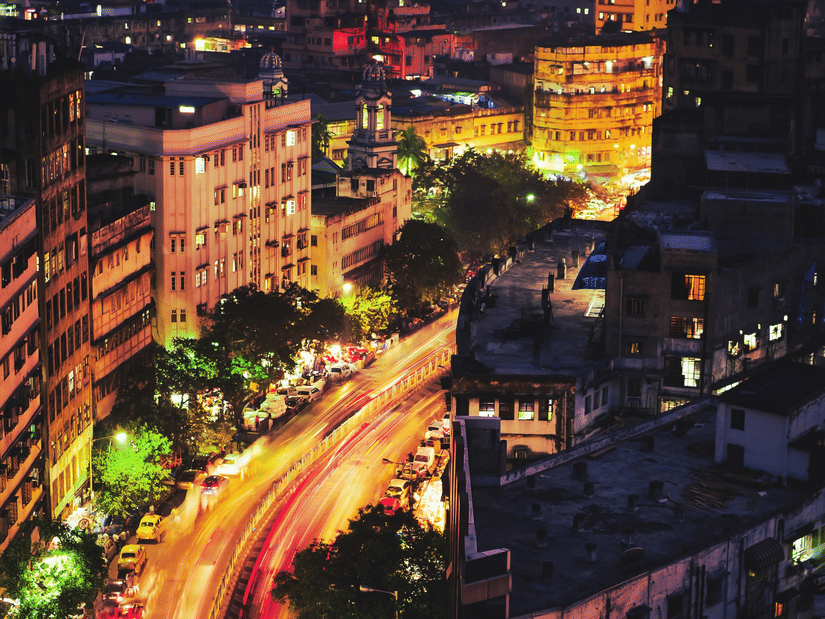 An aerial view of Park Street in Kolkata with a long exposure of vehicles moving on the road as seen during twilight hour.