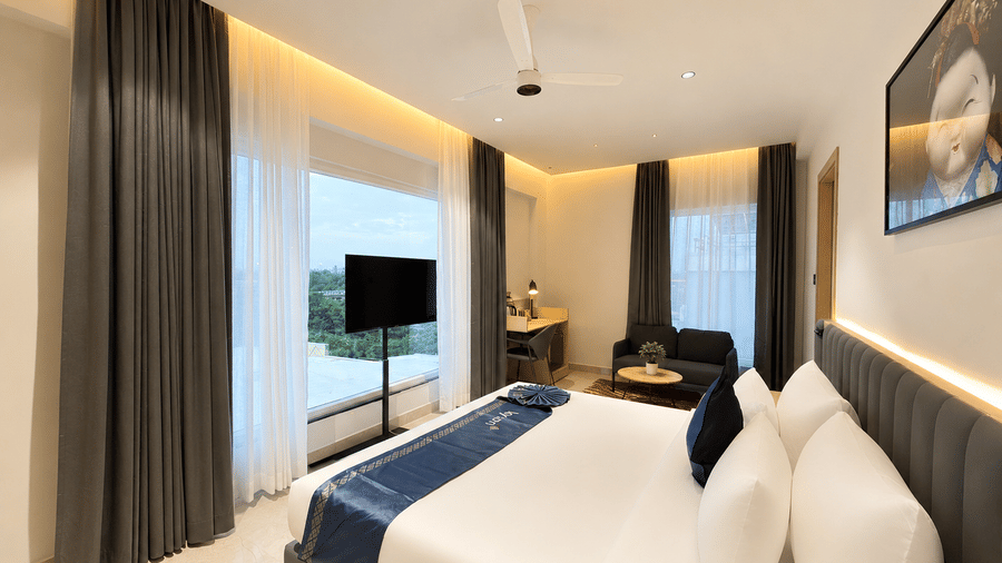 Luxury Suite bed with skyline window – Hotel Kyzen, Shamshabad Airport, Hyderabad