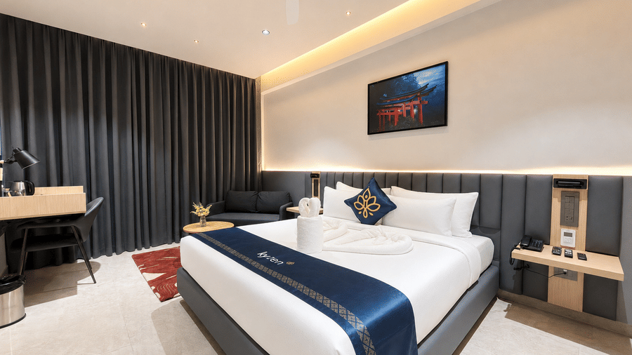 Premium Suite King Bed and artwork – Hotel Kyzen, Shamshabad Airport, Hyderabad