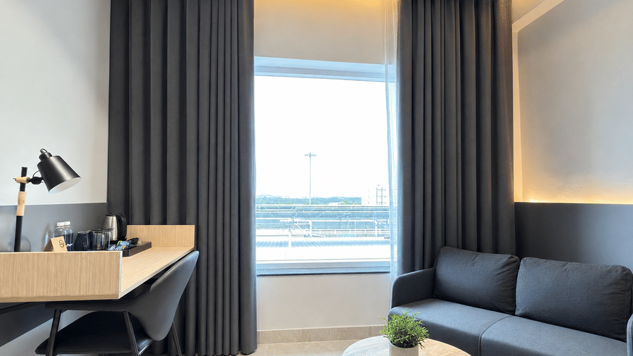 Premium Suite King Beds lounge and desk – Hotel Kyzen, Shamshabad Airport, Hyderabad