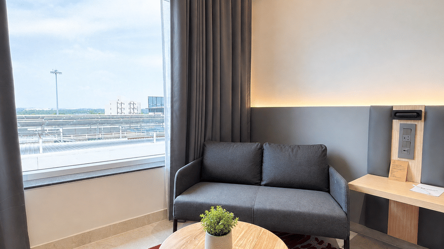 Premium Suite King Beds sofa with view – Hotel Kyzen, Shamshabad Airport, Hyderabad