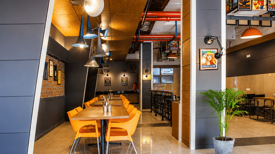 Restaurant seating area with modern interiors at Max Hotel Jabalpur.