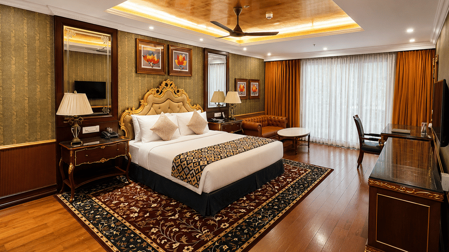 1. Regent Villa Regent Villa bedroom with wooden ceiling and elegant traditional decor at MAYFAIR Lake Resort, Raipur