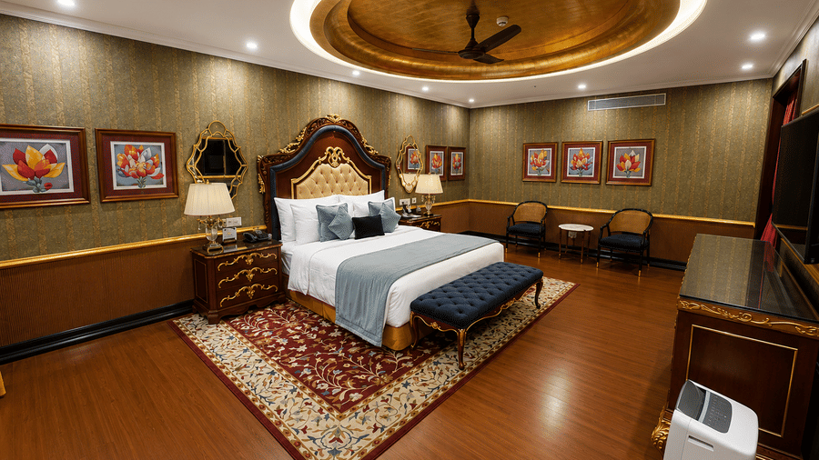 Royal Villa bedroom with golden ceiling accent and luxurious interiors at MAYFAIR Lake Resort, Raipur