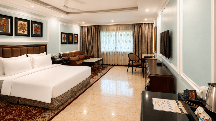 Standard Deluxe Room with king-size bed and elegant interiors at MAYFAIR Lake Resort, Raipur