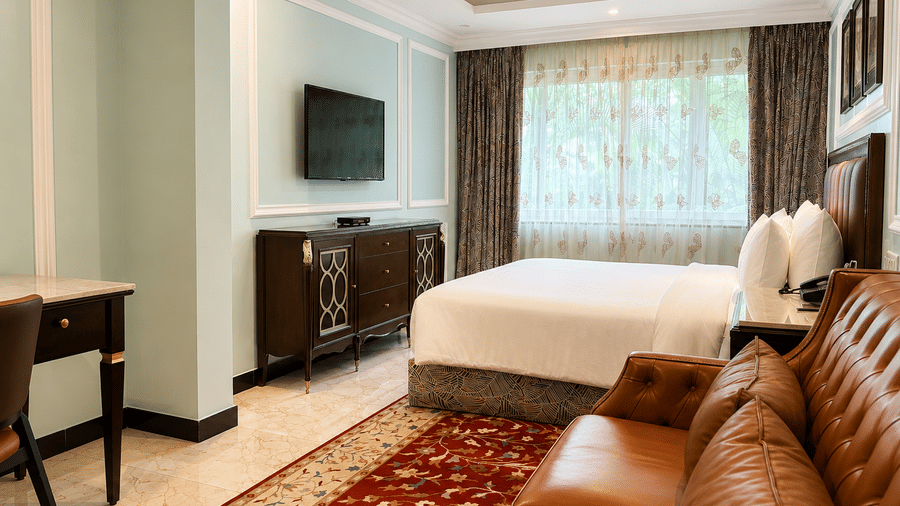 Standard Room with plush bedding and cozy seating area at MAYFAIR Lake Resort, Raipur