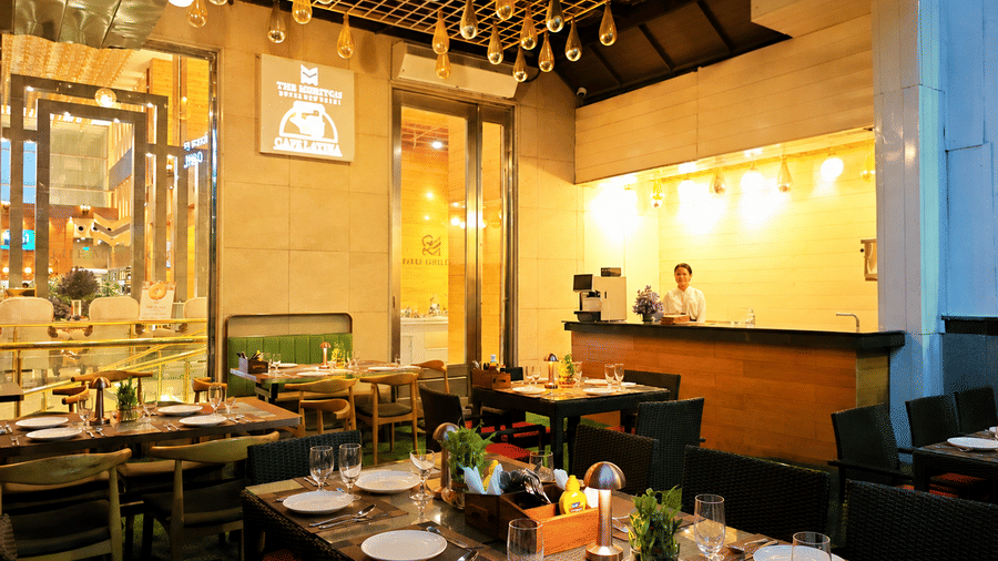Elegant indoor seating area at Cafe Latina featuring warm lighting, stylish decor, and a cosy dining ambience ideal for relaxed meals and casual gatherings.