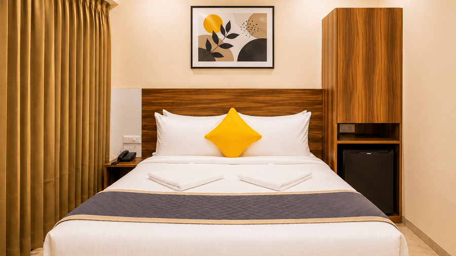 Comfortable room at Urban Comforts featuring modern interiors, warm lighting, and thoughtfully designed furnishings