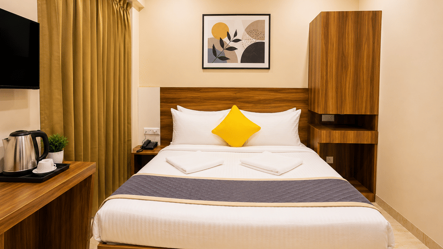 Modern room interior at Urban Comforts featuring comfortable bedding, warm lighting, and thoughtfully designed contemporary furnishings