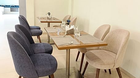 Seating arrangement inside the restaurant 5 - Starlit Suites, Shirdi