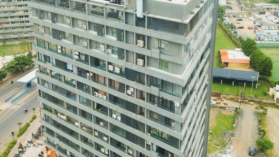 an aerial view of Lords Inn Rajkot showcasing the neighbouring area with lush greenery and other buildings