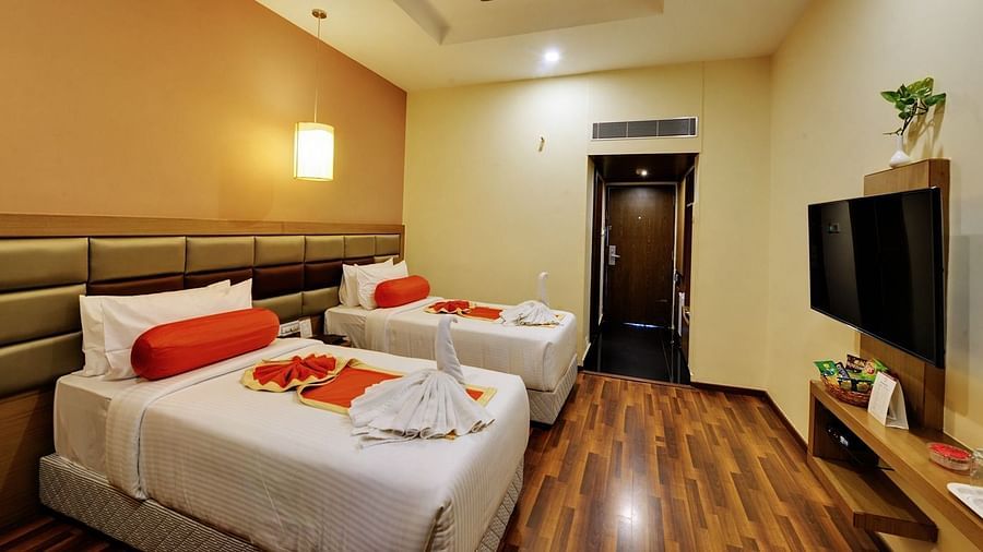 Club Room with plush twin beds and white linens