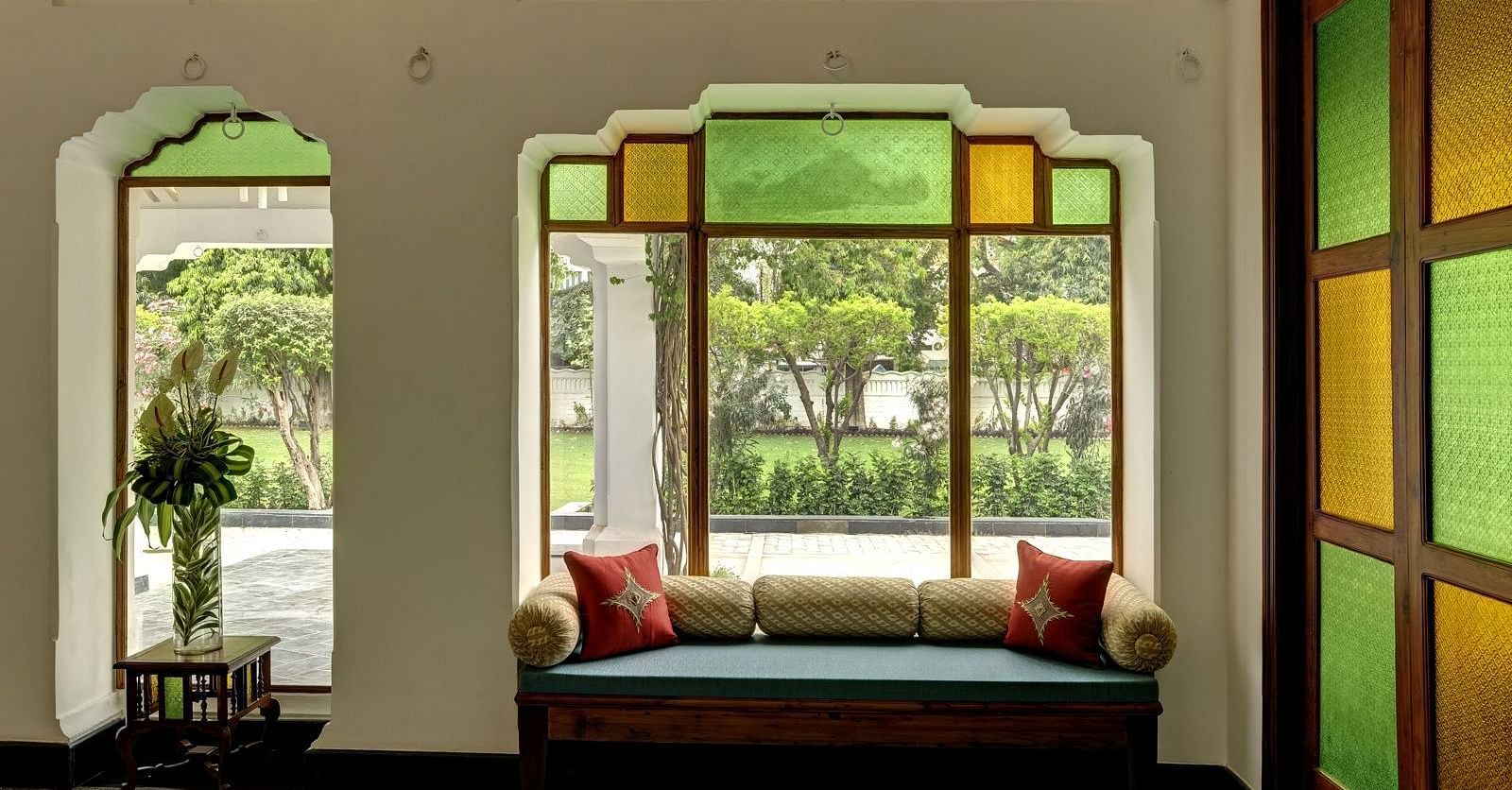 Lobby area of Saraca Hotel, Lucknow with coloured panes on the windows
