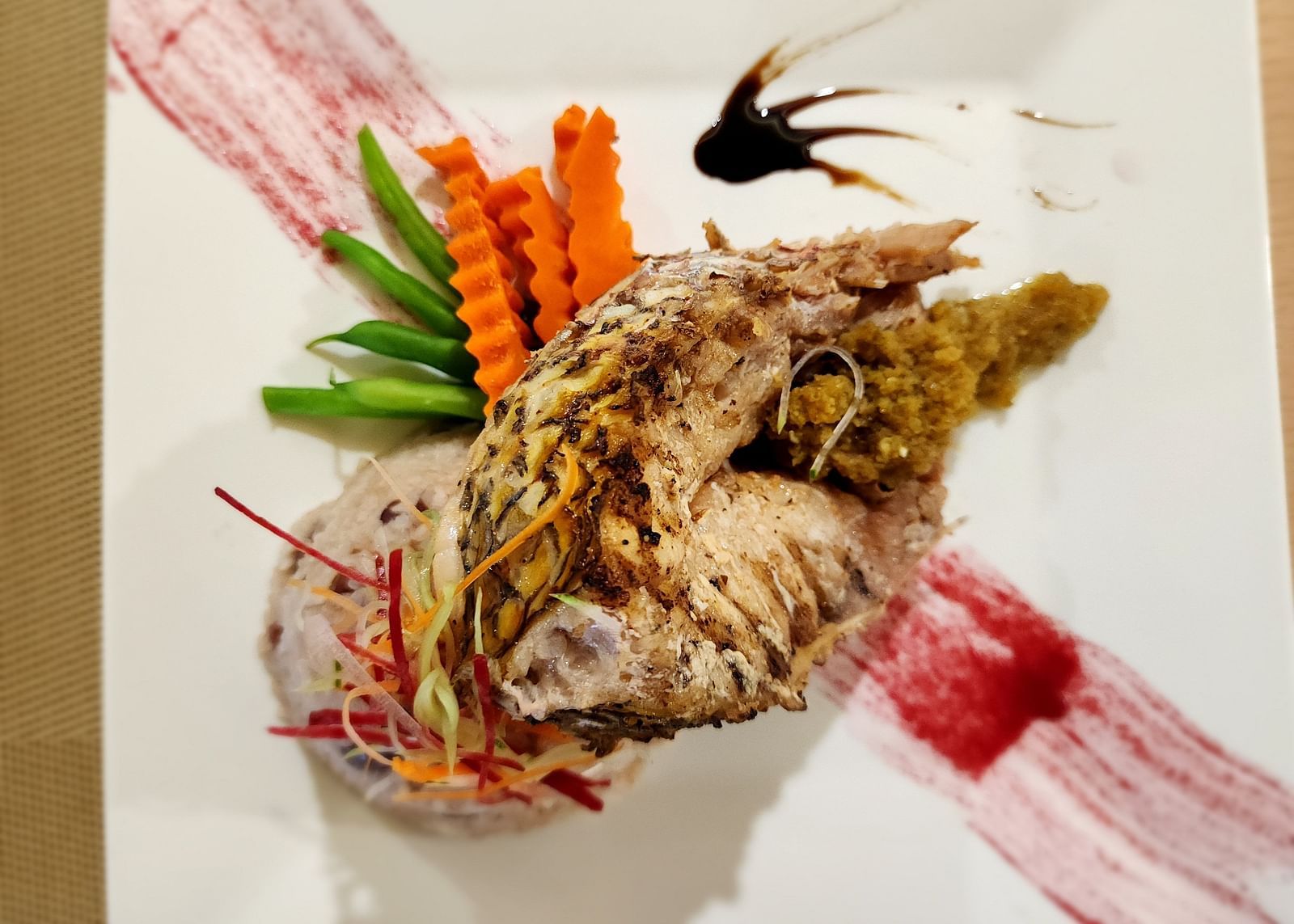 A lobster dish served with a side of sauce - Hotel 39, Jamaica