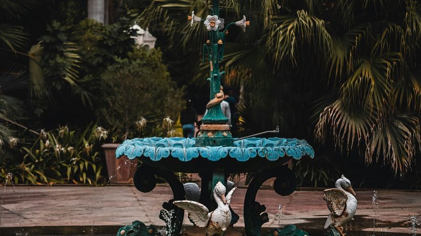 A fountain with bird statues on it inside Saheliyon Ki Bari in Udaipur